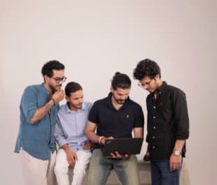 Yuvichaar team reviewing work together